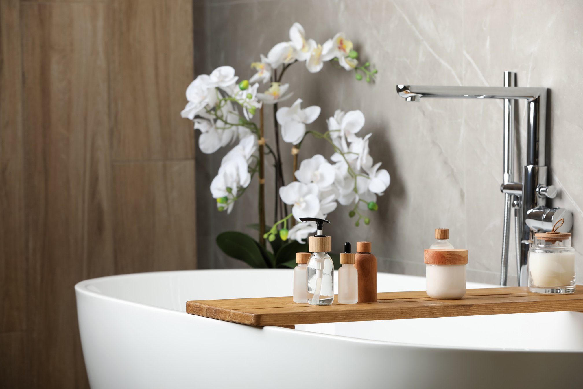 Different Personal Care Products on Bath Tray Indoors